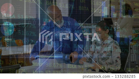 Four professionals discussing financial data in corporate office, with laptop smartphone and tablet 133288285