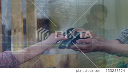 Customer tapping smartphone against card reader at checkout, plaid sleeves, stock data overlay Customer tapping smartphone against card reader at checkout, plaid sleeves, stock data overlay 133288324