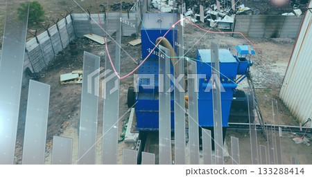 Operating blue industrial machines crushing scrap in scrap yard, with data visualization overlays 133288414