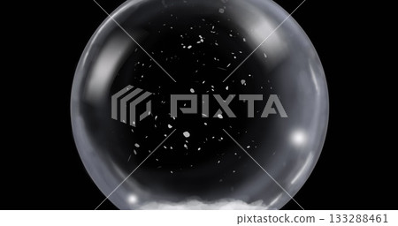 Displaying translucent sphere holding white particles in black studio void, with interior mist 133288461