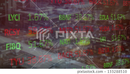 Displaying financial overlay over urban night cityscape with floating tickers and glowing lines 133288510