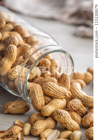 Peanuts in shell. Groundnuts in jar on kitchen table. Peanuts in shell. Groundnuts in jar on kitchen table. 133288679