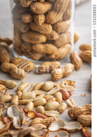 Peanuts in shell. Groundnuts on kitchen table. 133288683