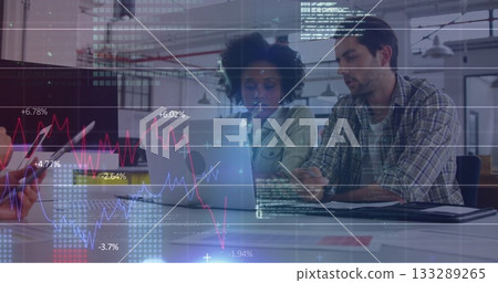 Collaborating colleagues analyzing financial data on laptop in office with charts and smartphone Collaborating colleagues analyzing financial data on laptop in office with charts and smartphone 133289265