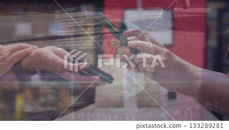 Exchanging smartphones, two women colleagues sharing digital data in tech office, binary overlay Exchanging smartphones, two women colleagues sharing digital data in tech office, binary overlay 133289281