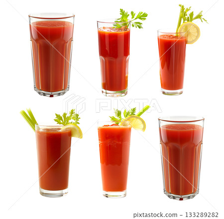 A tall glass of tomato juice beautifully garnished with fresh herbs, ideal for healthy drinks 133289282