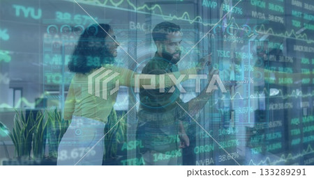 Using office digital display, two professionals wearing suits analyzing stock data with plants 133289291