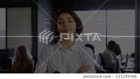 Standing adult female professional crossing arms in open plan office, with waveform overlay Standing adult female professional crossing arms in open plan office, with waveform overlay 133289306