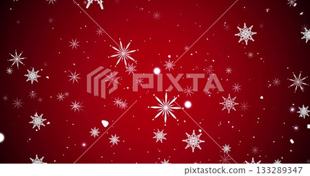 Floating white snowflake shapes over red backdrop, showing light spots and particle fragments 133289347