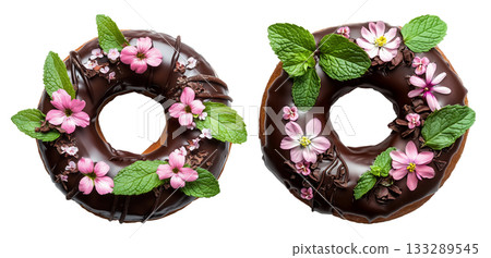 Donut with chocolate glaze decorated with colorful edible flowers and mint leaves, isolated on a white background. Donut with chocolate glaze decorated with colorful edible flowers and mint leaves, isolated on a white background. 133289545
