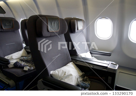 Frankfurt, Germany, June 10, 2019: Premium Economy Seats by the Window on a Long Haul Aircraft Frankfurt, Germany, June 10, 2019: Premium Economy Seats by the Window on a Long Haul Aircraft 133290170