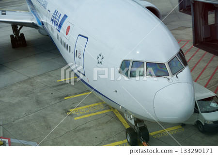 Frankfurt, Germany, June 10, 2019: Long Haul Aircraft at the Gate Viewed from the Airport Lounge Frankfurt, Germany, June 10, 2019: Long Haul Aircraft at the Gate Viewed from the Airport Lounge 133290171