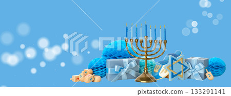 Hanukkah menorah with blue candles surrounded by wrapped gifts Hanukkah menorah with blue candles surrounded by wrapped gifts 133291141