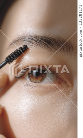 Young Japanese woman with eyebrow mascara 133291173