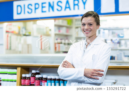 Woman pharmacist handling prescription containers on counter at pharmacy dispensary, copy space 133291722