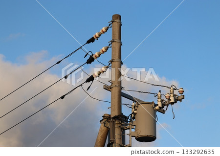 Pole-mounted transformer attached to a utility pole Pole-mounted transformer attached to a utility pole 133292635