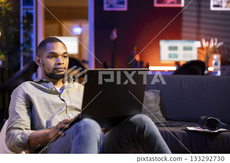 Economic researcher checking monthly balance online on laptop, working on reducing costs to increase profit. Financial advisor examining global investment funds, expansion strategy. 133292730