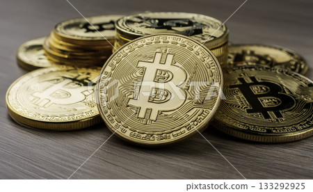 Close-up of a heap of bitcoin replicas symbolizing cryptocurrency wealth 133292925