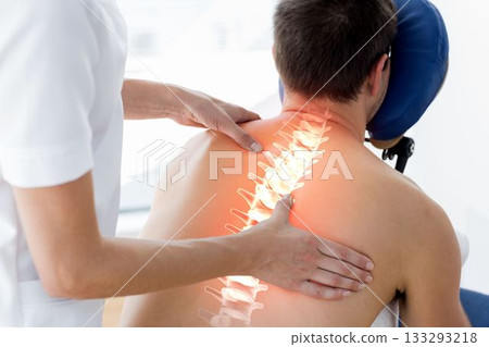 Highlighted spine of man having massage Highlighted spine of man having massage 133293218
