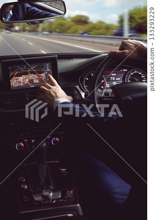 Man wearing business attire is driving flat design car on highway with touchscreen gauges Man wearing business attire is driving flat design car on highway with touchscreen gauges 133293229
