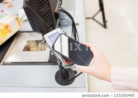 Cropped image person making mobile payment 133293495