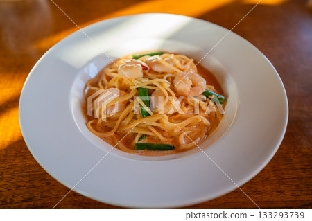 A photo of a delicious shrimp tomato cream pasta served at a cafe in Abashiri, Hokkaido. A photo of a delicious shrimp tomato cream pasta served at a cafe in Abashiri, Hokkaido. 133293739