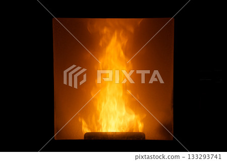 A photo of the warm, dreamy glow of a flame burning through the glass of a Hokkaido stove. A photo of the warm, dreamy glow of a flame burning through the glass of a Hokkaido stove. 133293741