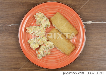 Fish Filets and French Salad 133294199