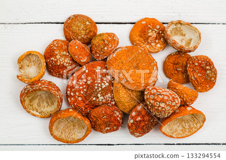 Dried fly agaric on a white background. 133294554