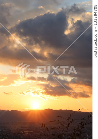 The sun coming out of the clouds 133294709