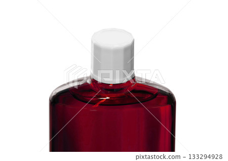 A red translucent bottle of hair growth product with a screw cap A red translucent bottle of hair growth product with a screw cap 133294928
