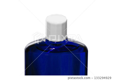 A blue translucent bottle of hair growth product with a screw cap A blue translucent bottle of hair growth product with a screw cap 133294929