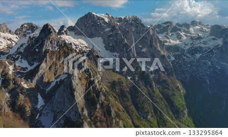 Rocky snow mountains before sunset aerial Rocky snow mountains before sunset aerial 133295864