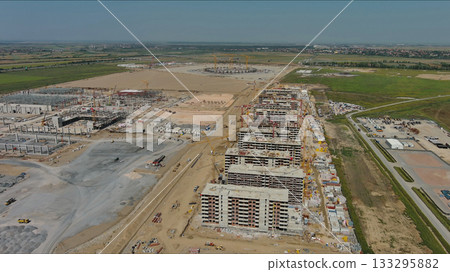 Industrial construction site with construction equipment and materials 133295882