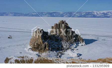 Shaman rock in frozen lake Baikal Shaman rock in frozen lake Baikal 133295909