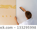 Carefully correcting distortions with a brush - Wallpaper replacement 133295998
