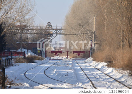 A railway track covered in snow leading into the Unit 731 Prison Camp 133296064