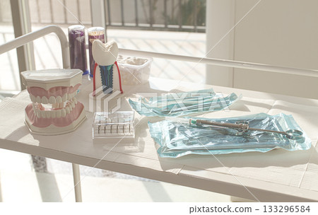 Sterile medical instruments, lying on a tray in protective packaging, dentist's instruments, preparation for a medical procedure. 133296584