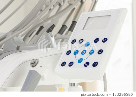 Dental equipment control panel in a modern clinic during a routine check-up session Dental equipment control panel in a modern clinic during a routine check-up session 133296590