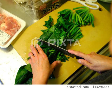 Kitchen cooking vegetables meat cutting woman hand tags Kitchen cooking vegetables meat cutting woman hand tags 133296653
