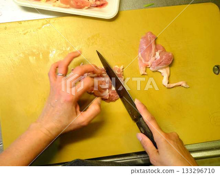 Kitchen cooking vegetables meat cutting woman hand tags Kitchen cooking vegetables meat cutting woman hand tags 133296710