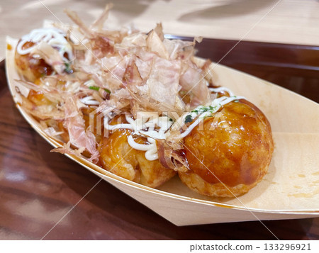 Takoyaki with sauce, topped with bonito flakes - a classic Osaka street food. 133296921