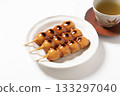 Mitarashi dumplings on a white plate 133297040