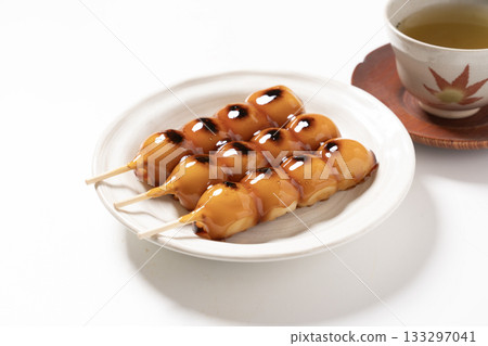 Mitarashi dumplings on a white plate Mitarashi dumplings on a white plate 133297041