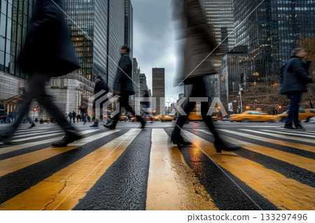 Busy city street scene with blurred pedestrians and iconic yellow taxis in urban environment 133297496
