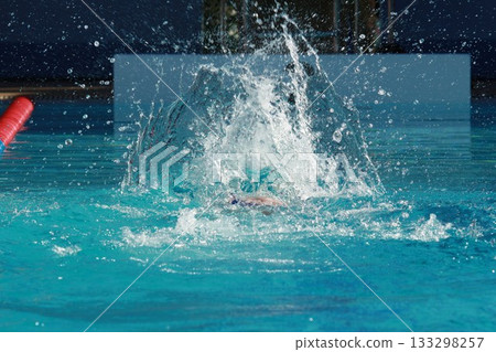 Swimming competition in the swimming pool, close up of water splashes 133298257