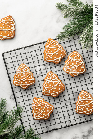Freshly Baked gingerbread Christmas Cookies shaped like trees on Cooling Rack. Christmas baking, top view 133298634