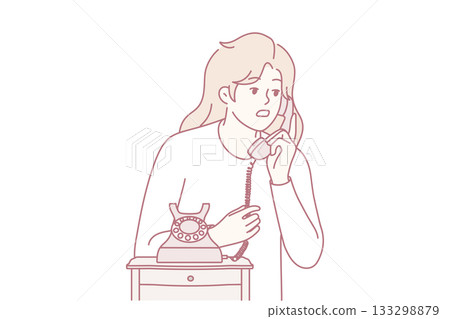 Young woman talk on landline phone Young woman talk on landline phone 133298879