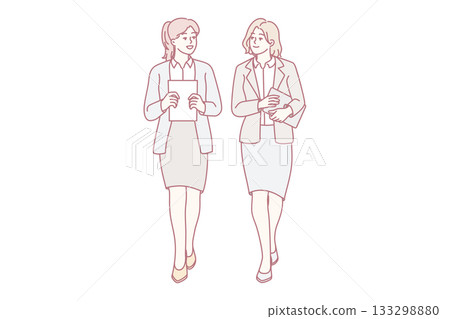 Businesswomen walk talking in office Businesswomen walk talking in office 133298880