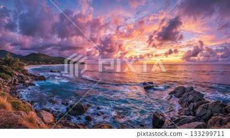 Dramatic sunset over tropical coastal landscape with rocky shoreline, turquoise waves, and vibrant pink and orange clouds reflecting on ocean water at golden hour Dramatic sunset over tropical coastal landscape with rocky shoreline, turquoise waves, and vibrant pink and orange clouds reflecting on ocean water at golden hour 133299711